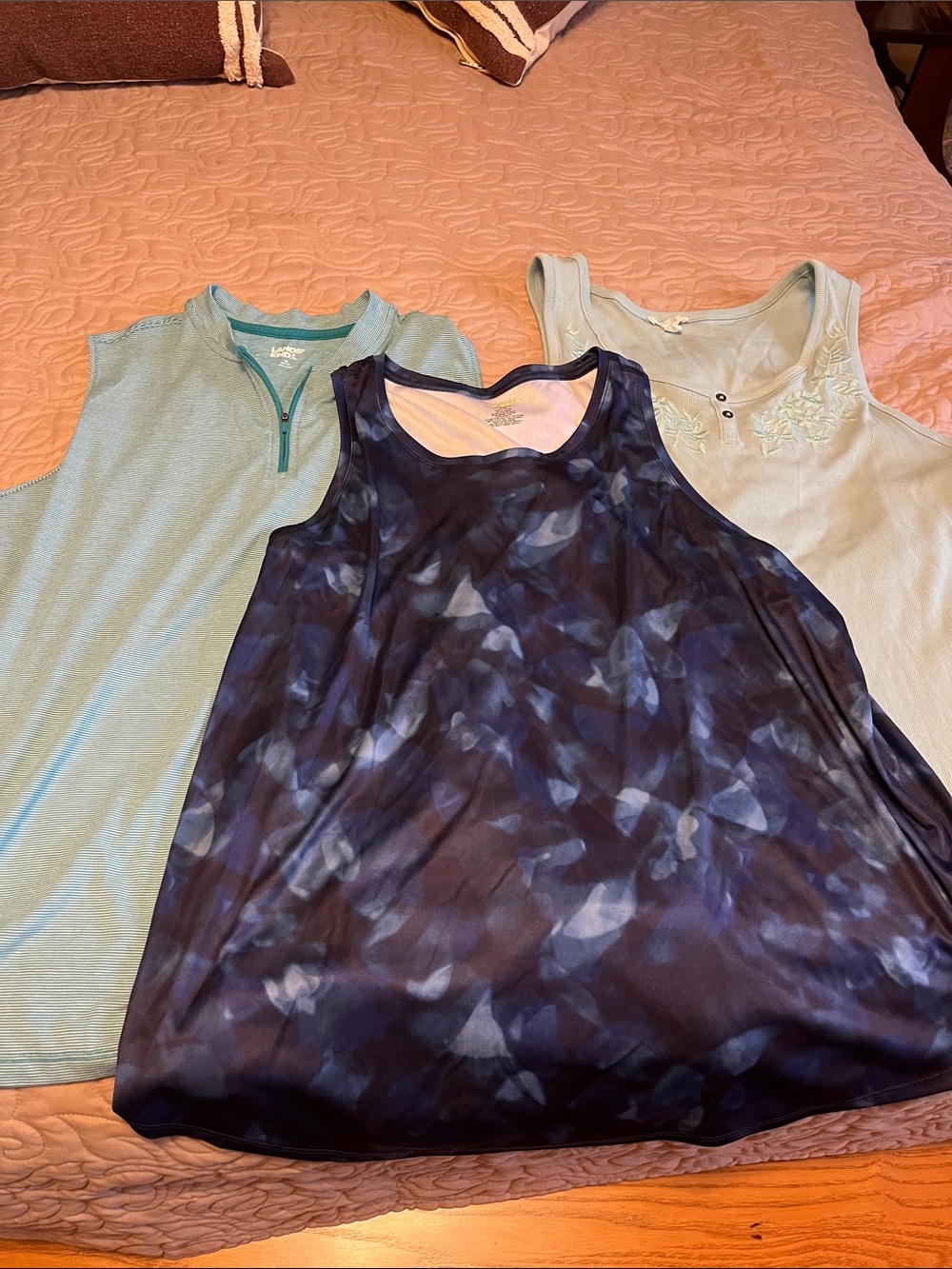 Three XL tank tops.